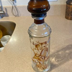 Vintage 1967 CABIN STILL Buck whiskey decanter. NWOT. Approximately 13 inch tall